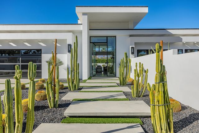 a view of a house with a small garden