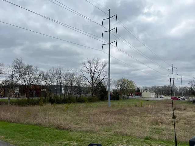 a view of a house with a big yard