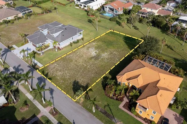 an aerial view of a city with lawn chairs