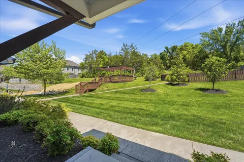 a view of a patio with a table and chairs with wooden floor