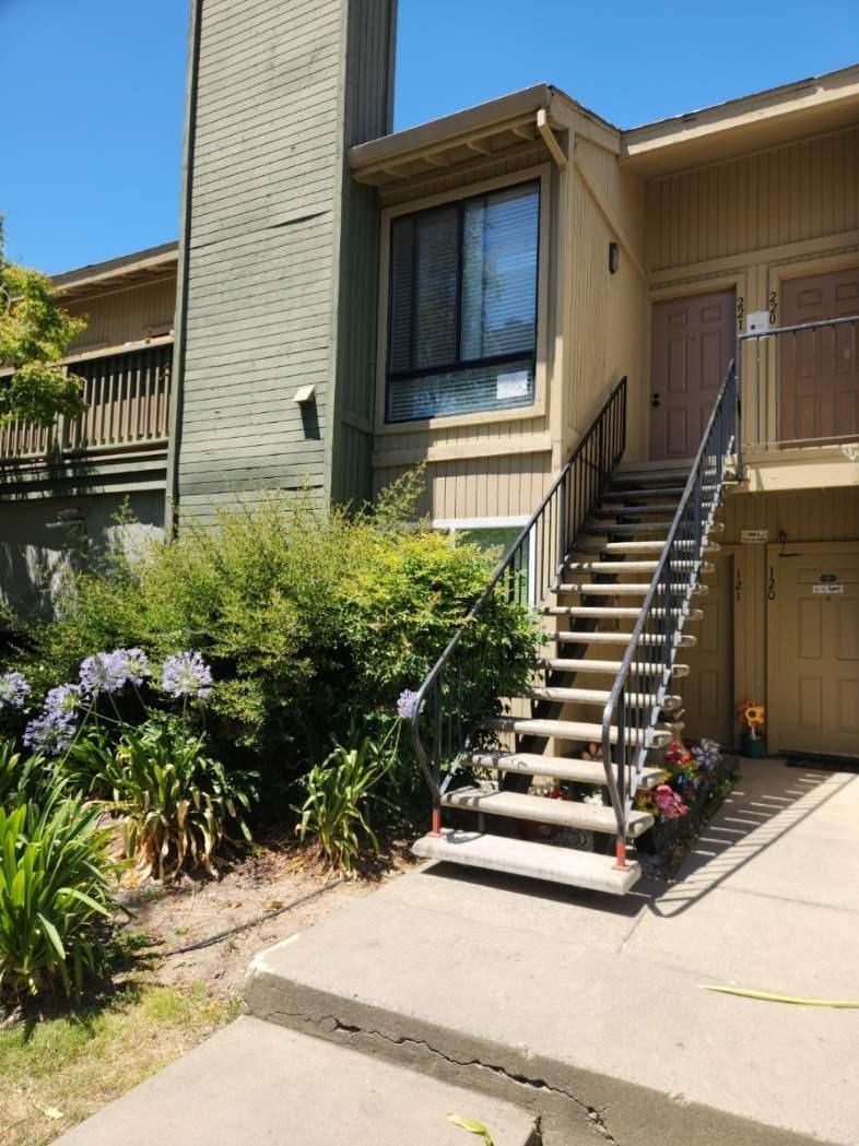 3939 Madison Avenue, Unit 221 North Highlands, CA 95660 - Photo 1 of 1 a flower garden with wooden fence