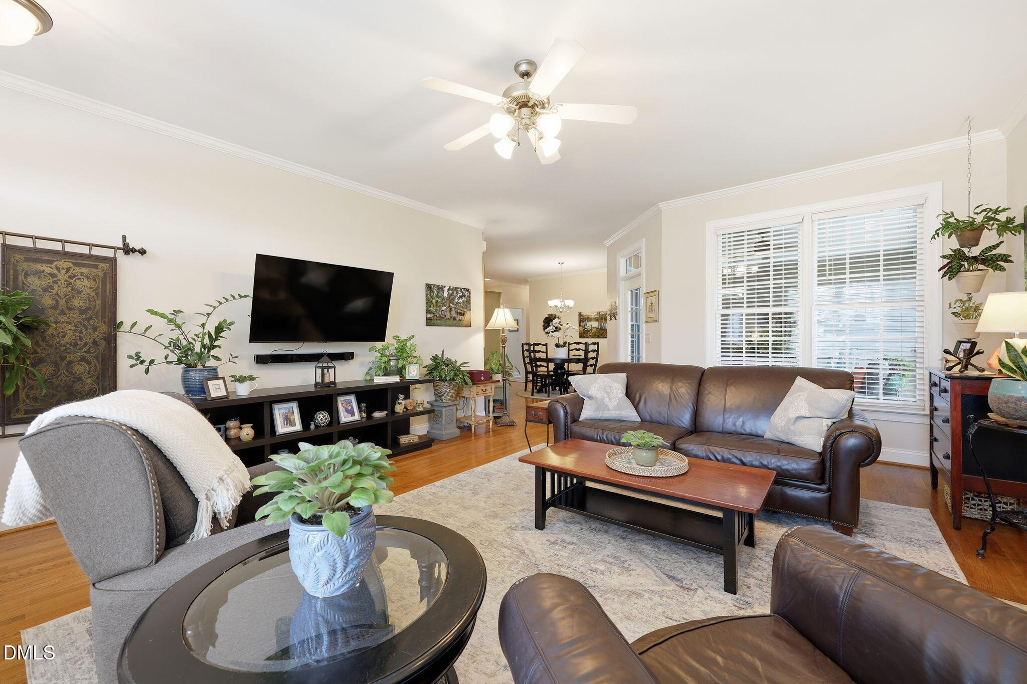 7040 Dayton Ridge Drive Apex, NC 27539 - Photo 5 of 38 a living room with furniture kitchen view and a flat screen tv