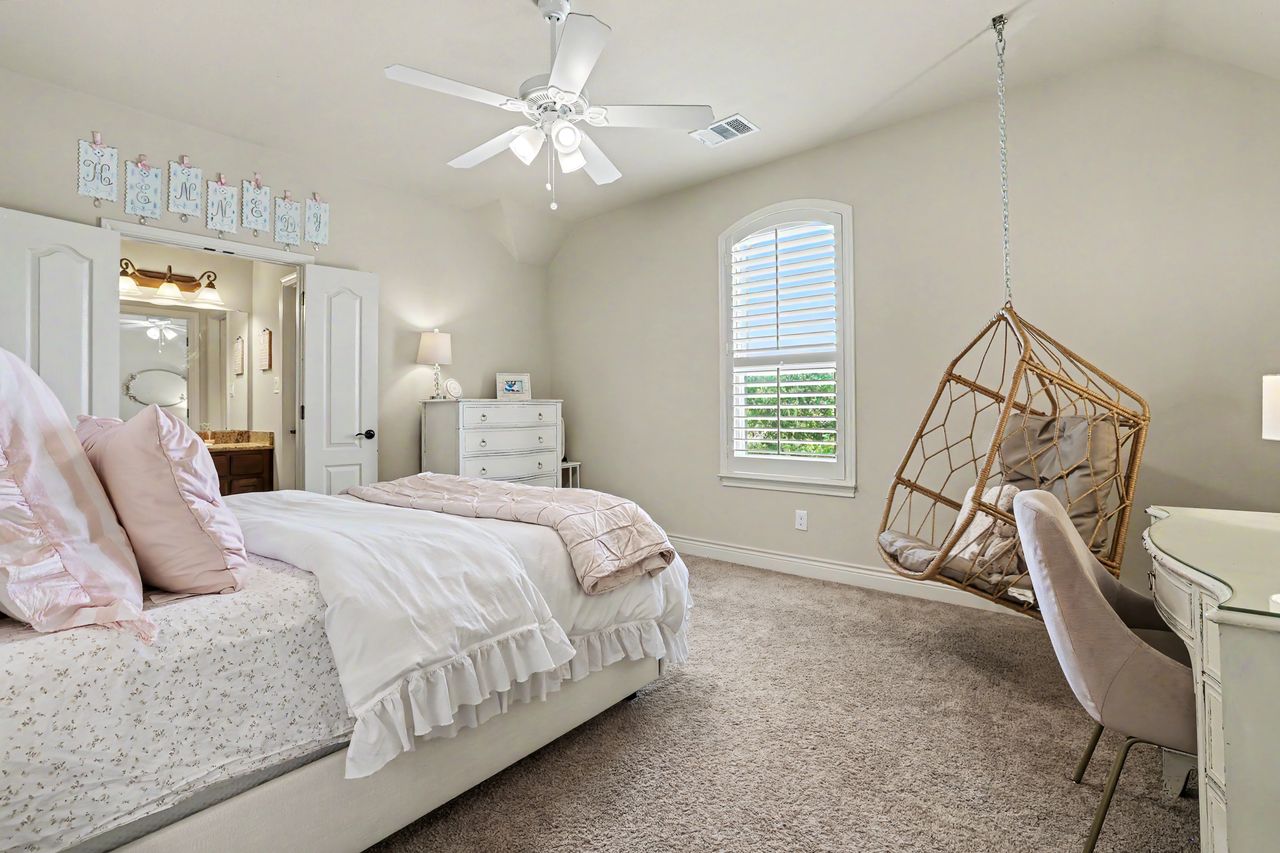 809 Prairie Dunes Drive Georgetown, TX 78628 - Photo 28 of 40 An inviting bedroom features a lofty ceiling, soft carpet, and a window providing natural light.