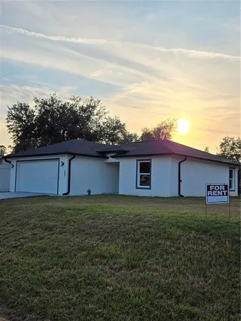 a view of a backyard of the house