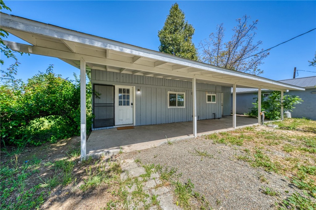 1980 Big Valley Road Lakeport, CA 95453 - Photo 17 of 56 a view of a house with a backyard and balcony