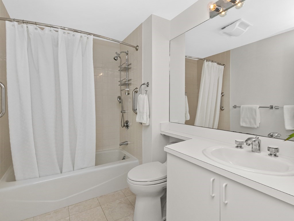 25 Marion Street, Unit PH3 Brookline, MA 02446 - Photo 12 of 22 a bathroom with a sink a toilet and shower