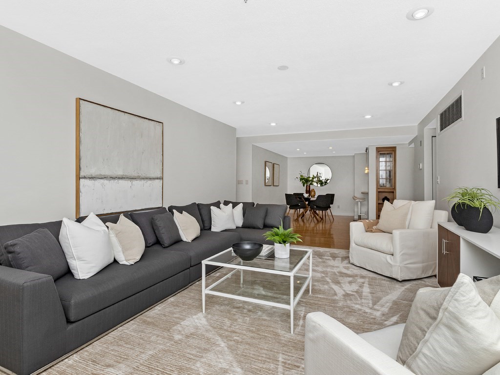 25 Marion Street, Unit PH3 Brookline, MA 02446 - Photo 3 of 22 a living room with furniture and a couch