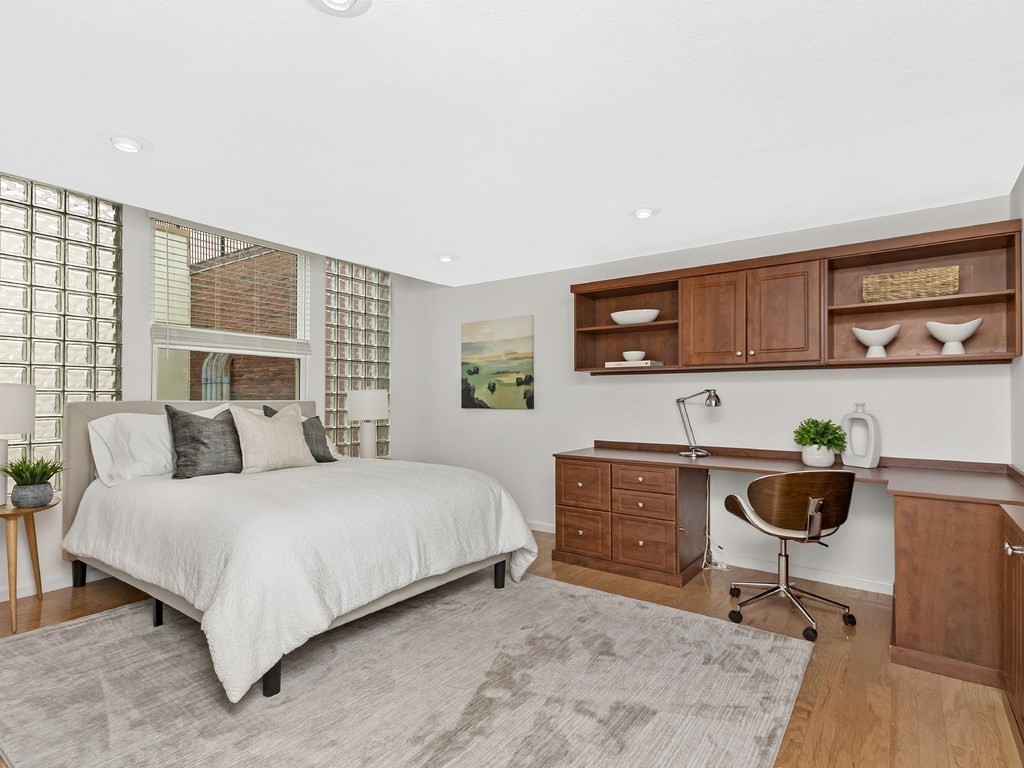 25 Marion Street, Unit PH3 Brookline, MA 02446 - Photo 10 of 22 a bedroom with a bed and dresser