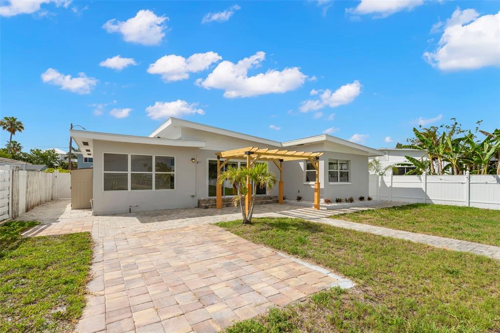 708 Sunset Cove Madeira Beach, FL 33708 - Photo 47 of 61 a front view of a house with garden