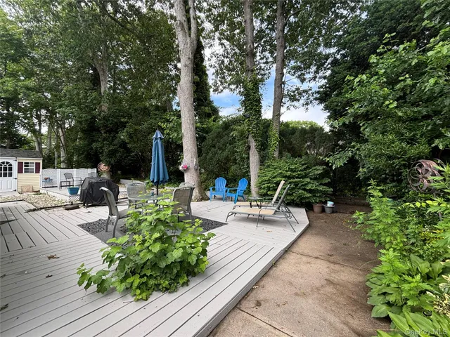 a view of a backyard with sitting area