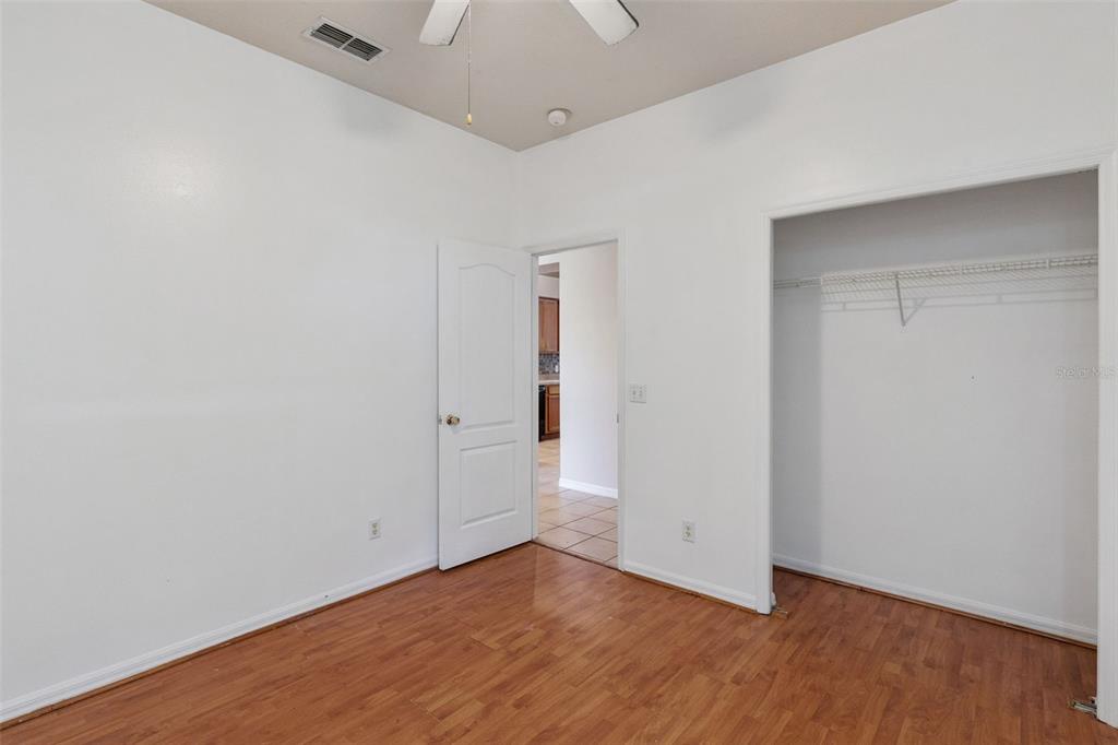 774 Lancer Circle Ocoee, FL 34761 - Photo 17 of 35 an empty room with wooden floor and windows