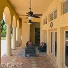 a view of a room with wooden floor and a window