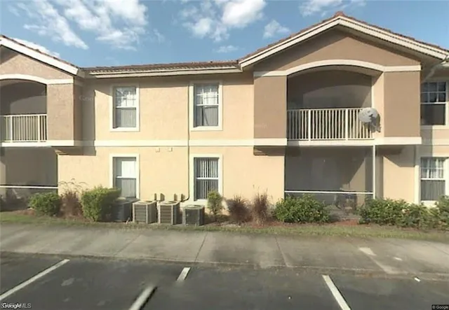 a kitchen with a refrigerator and a stove