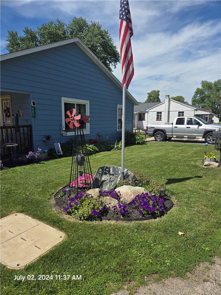 321 Liberty Street Eaton, OH 45320 - Photo 18 of 34 This charming home offers a well-maintained exterior and inviting curb appeal.
