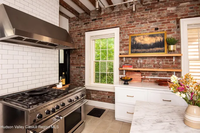 a kitchen with a stove and a microwave