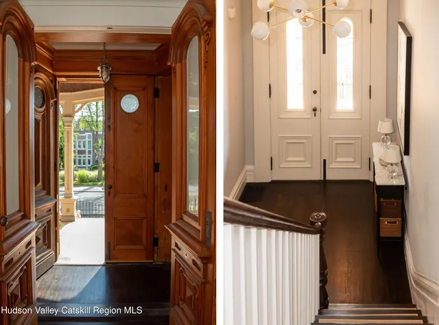 a view of a hallway with wooden floor and staircase