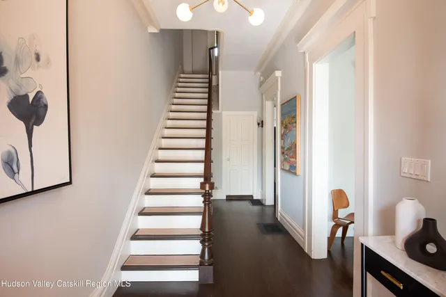 a view of entryway with wooden floor