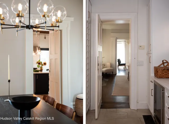 a view of a hallway and dining room and chandelier