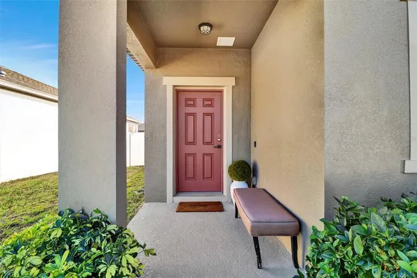 a front view of a house with outdoor seating