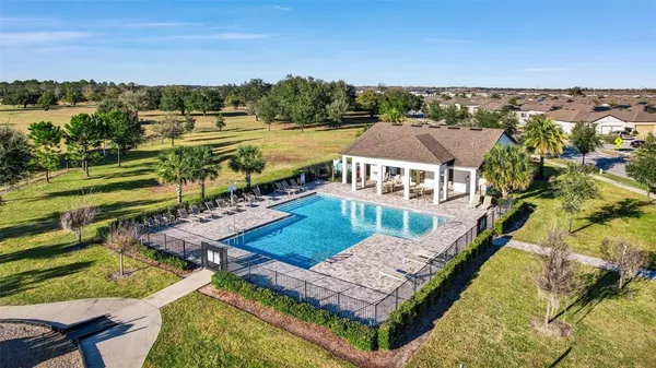 an aerial view of a house with a ocean view