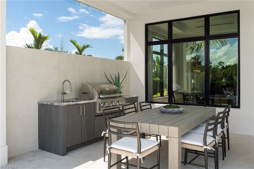 6704 Newport Road Naples, FL 34109 - Photo 37 of 47 a view of a dining room with furniture window and outside view