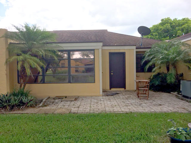 22477 Vistawood Way Boca Raton, FL 33428 - Photo 2 of 12 a front view of a house with garden