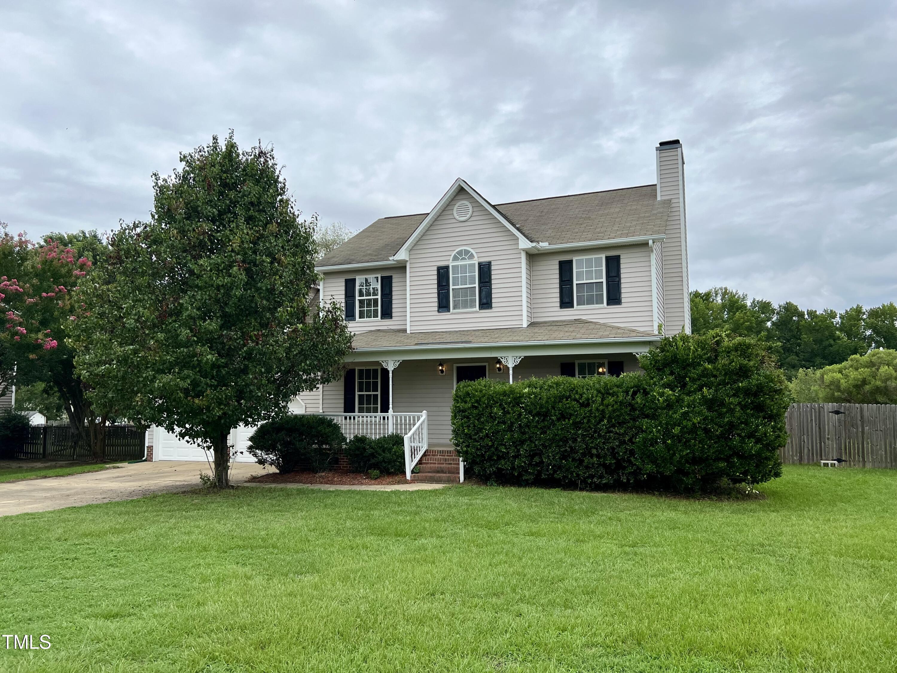 1312 Harvey Johnson Road Raleigh, NC 27603 - Photo 1 of 29 a front view of a house with a yard