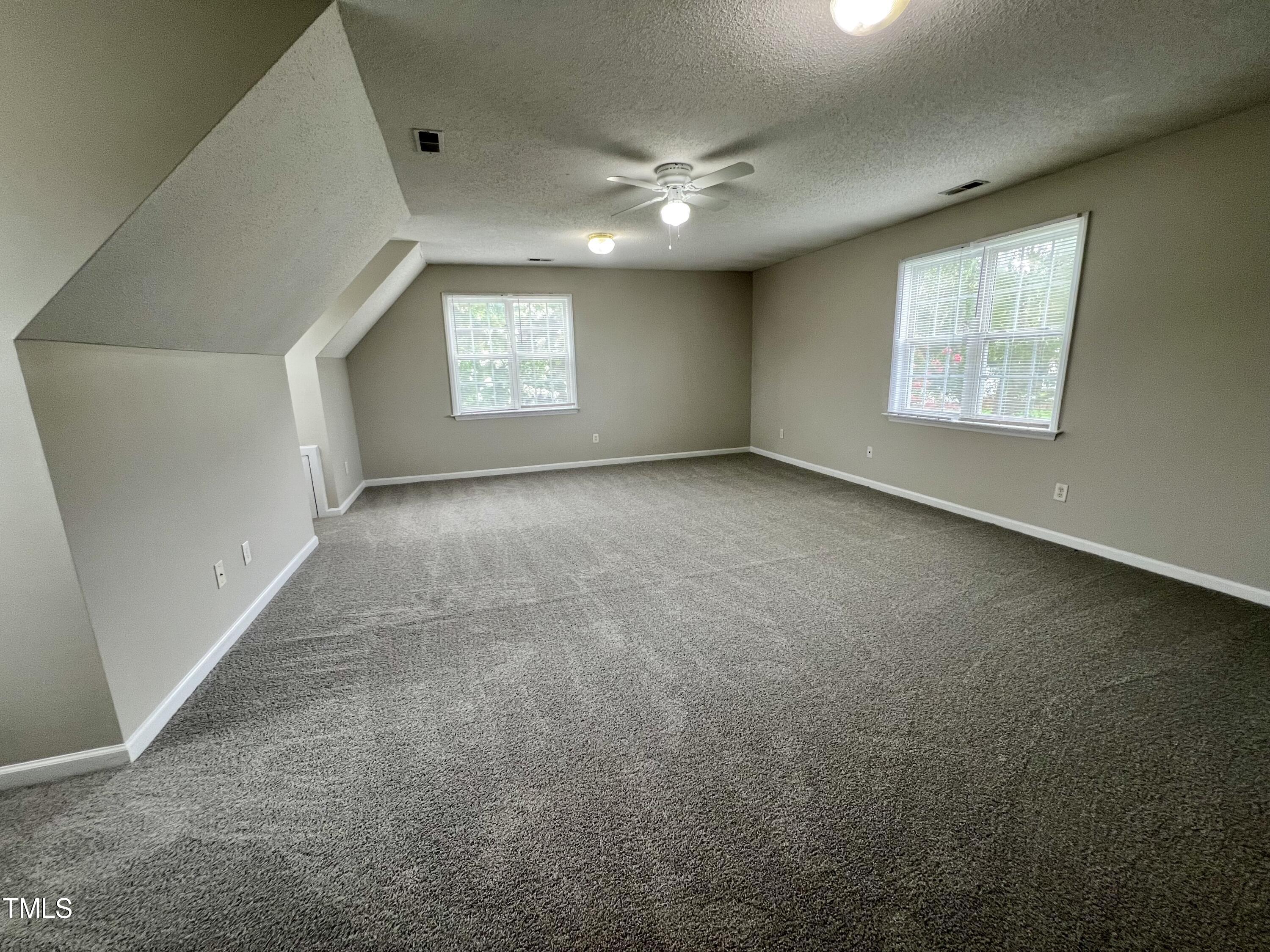 1312 Harvey Johnson Road Raleigh, NC 27603 - Photo 17 of 29 an empty room with windows and closet