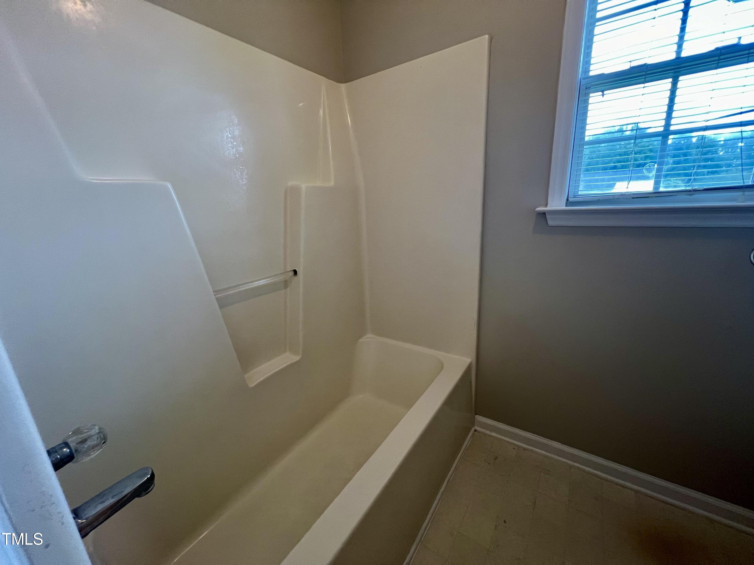 1312 Harvey Johnson Road Raleigh, NC 27603 - Photo 20 of 29 a bathroom with a bathtub