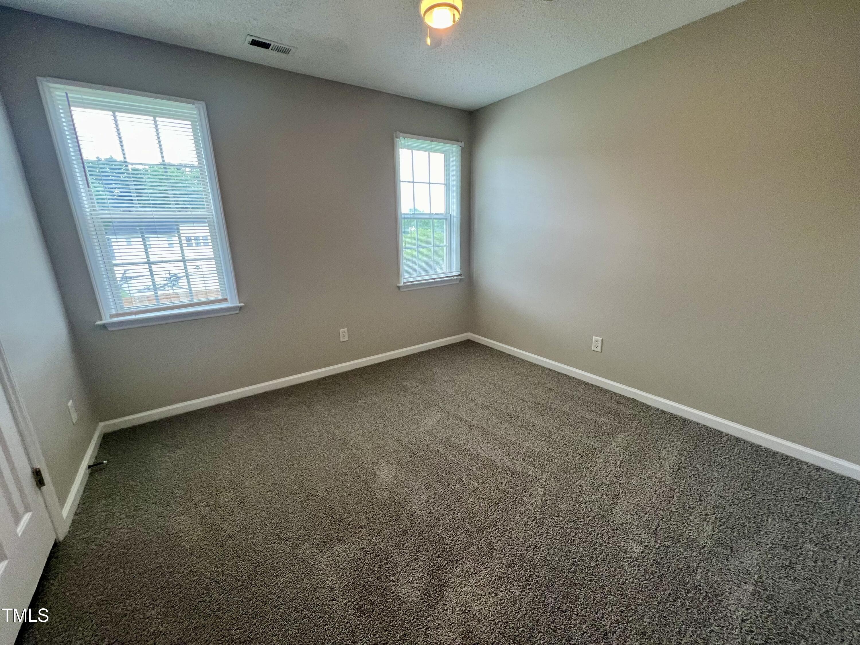 1312 Harvey Johnson Road Raleigh, NC 27603 - Photo 21 of 29 an empty room with windows