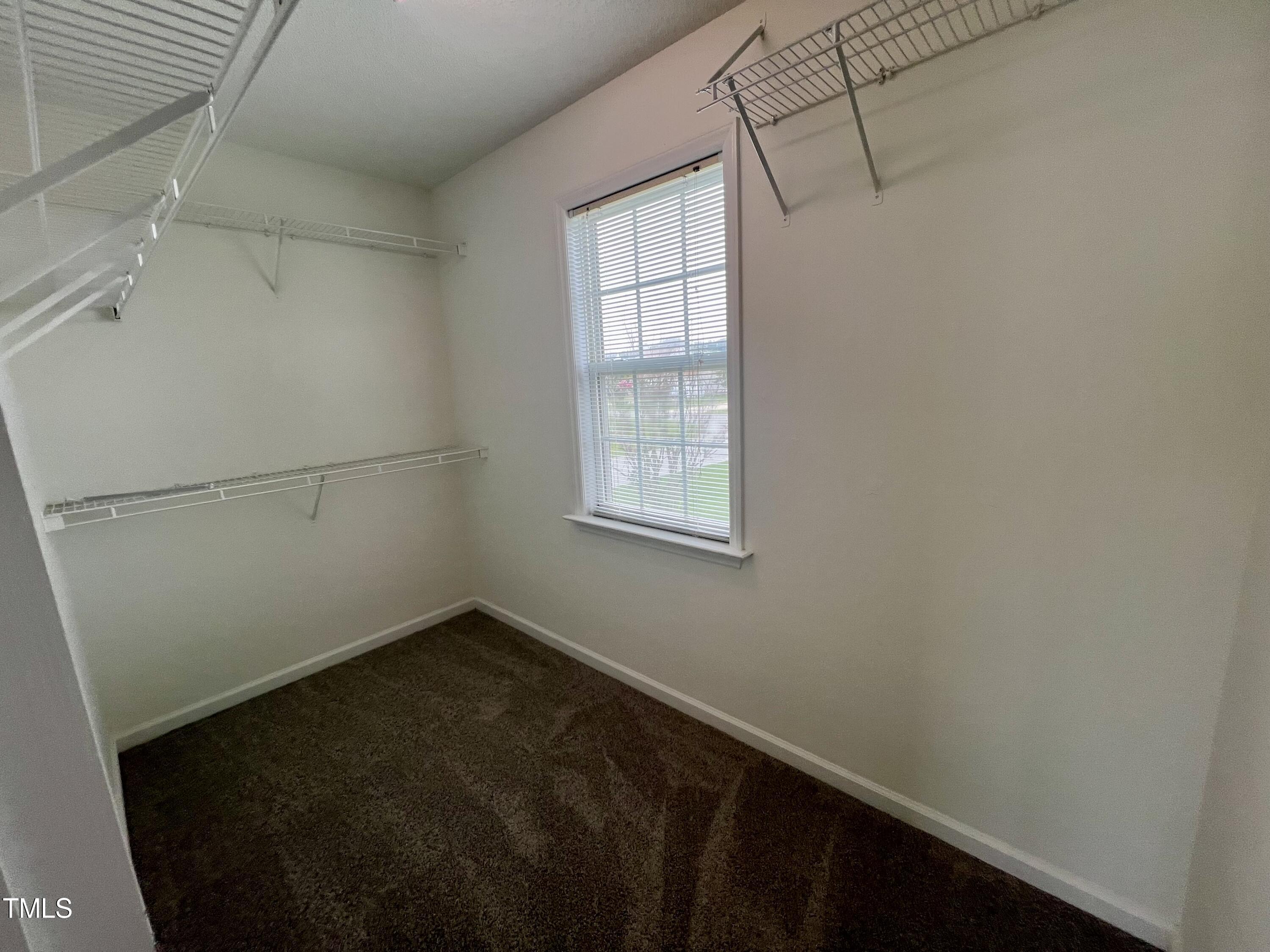 1312 Harvey Johnson Road Raleigh, NC 27603 - Photo 24 of 29 a view of a small space with racks on the wall