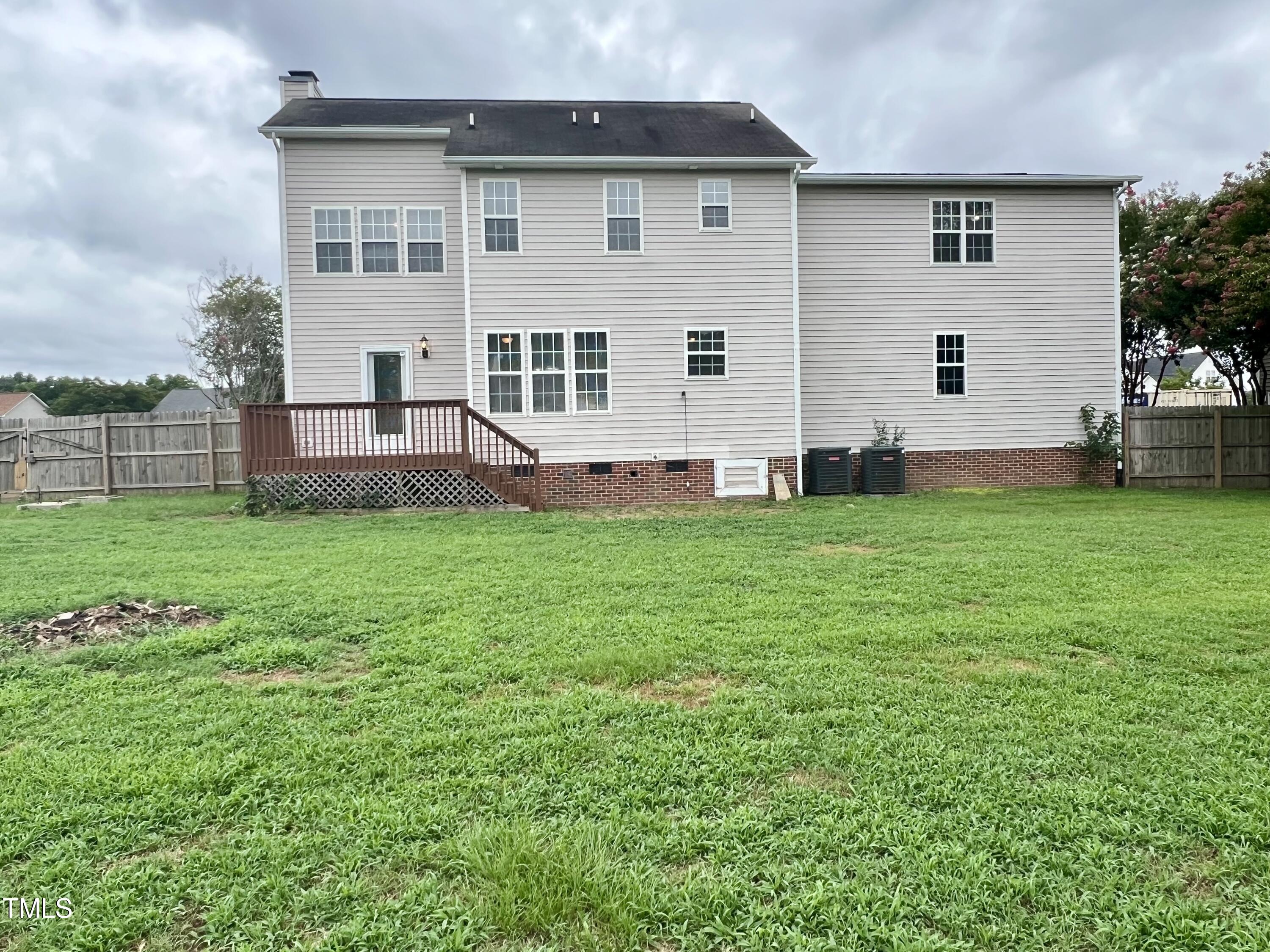 1312 Harvey Johnson Road Raleigh, NC 27603 - Photo 29 of 29 a view of a house with a yard and sitting area