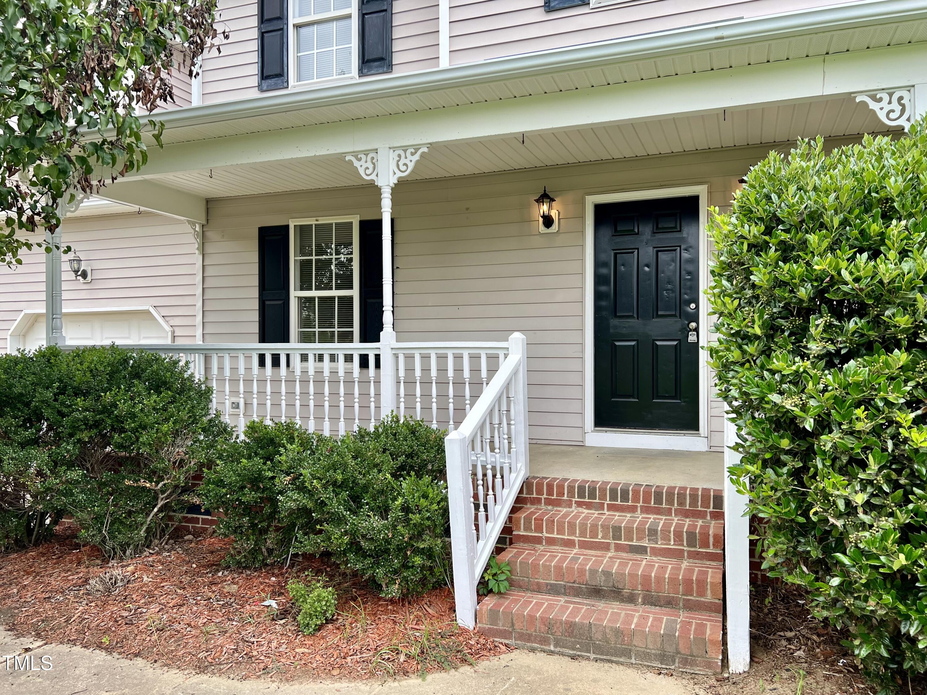 1312 Harvey Johnson Road Raleigh, NC 27603 - Photo 3 of 29 a front view of a house with a garden