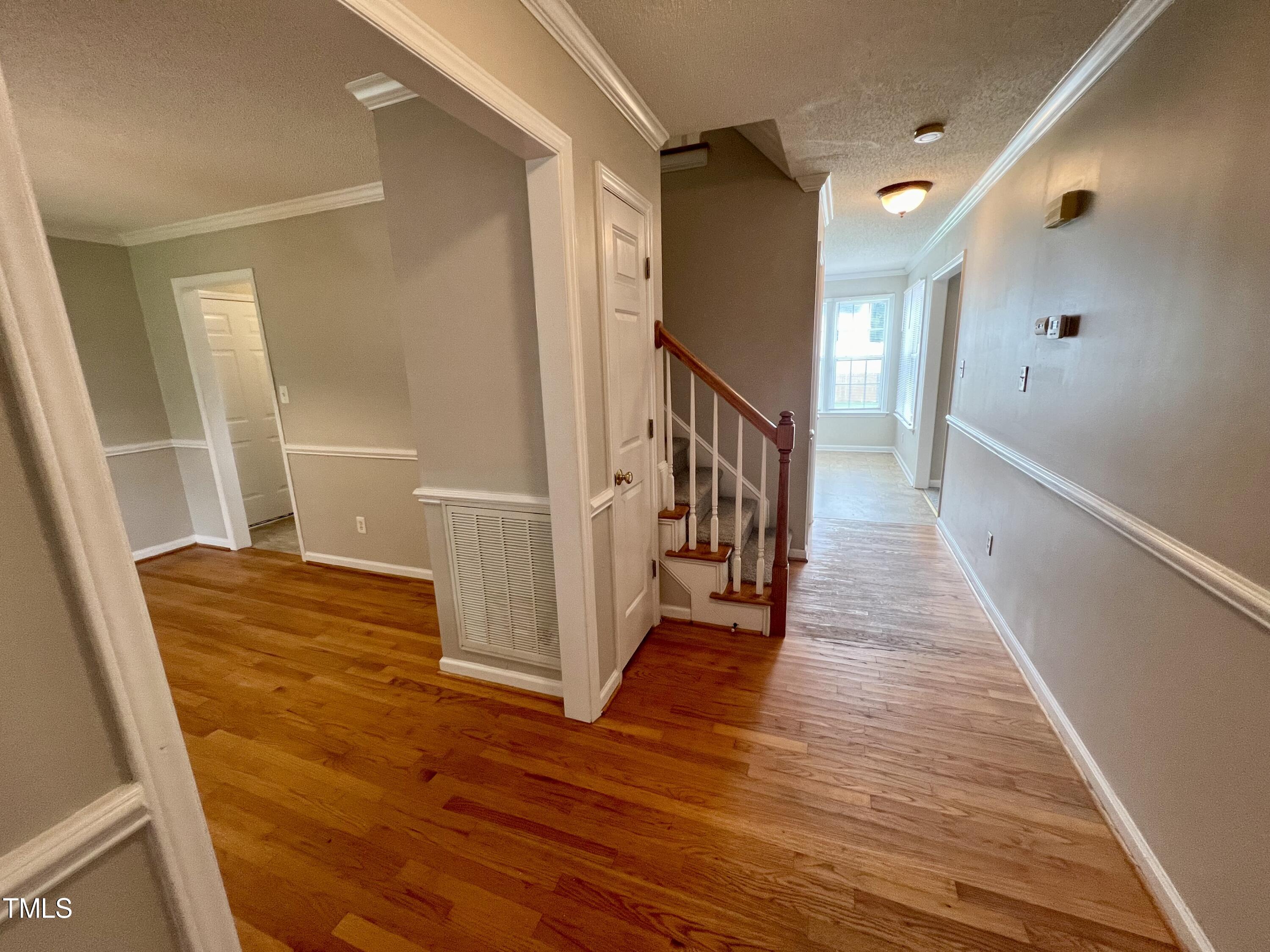 1312 Harvey Johnson Road Raleigh, NC 27603 - Photo 4 of 29 a view of entryway with wooden floor