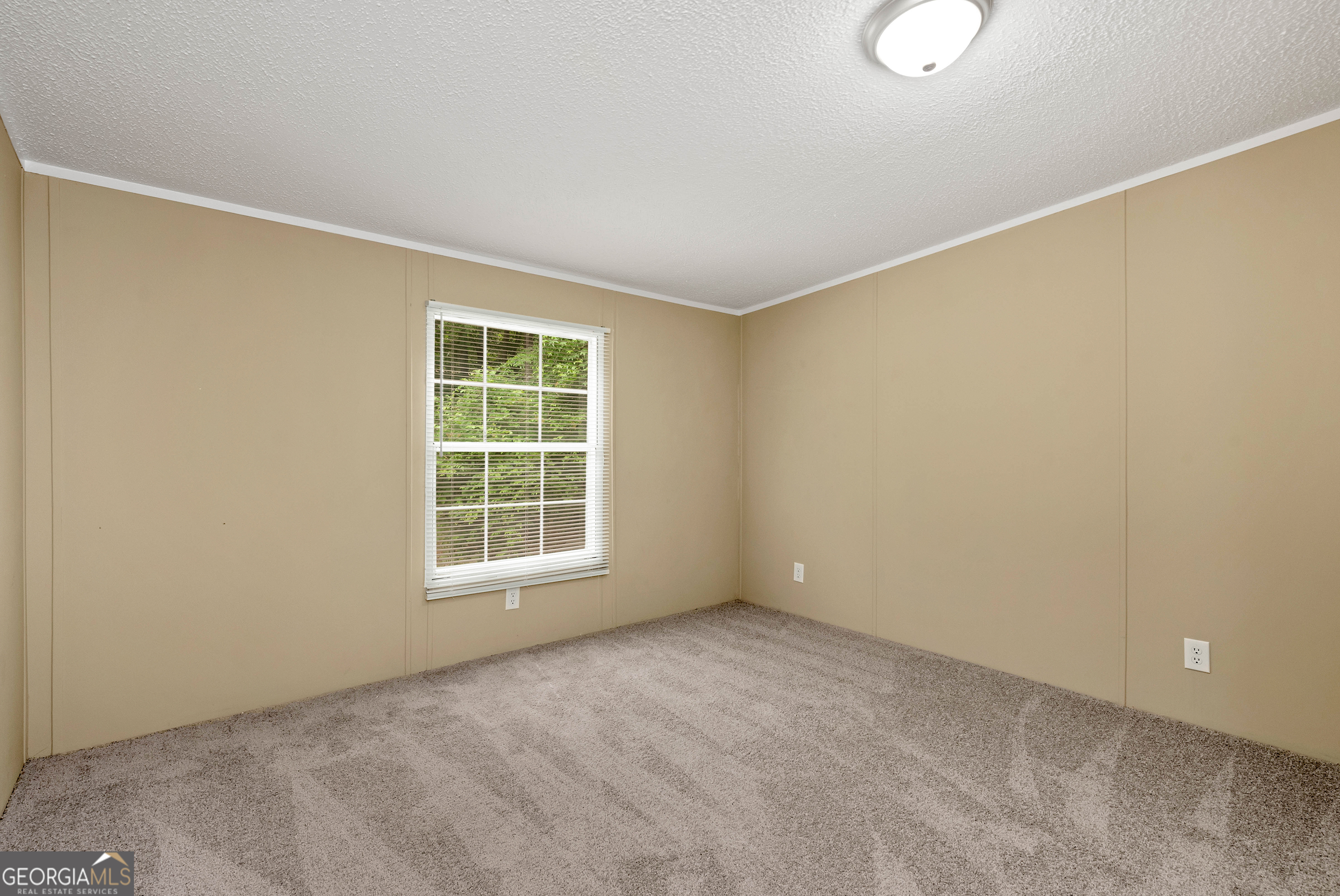 255 Double Branch Road Danielsville, GA 30633 - Photo 18 of 46 a view of an empty room with a window