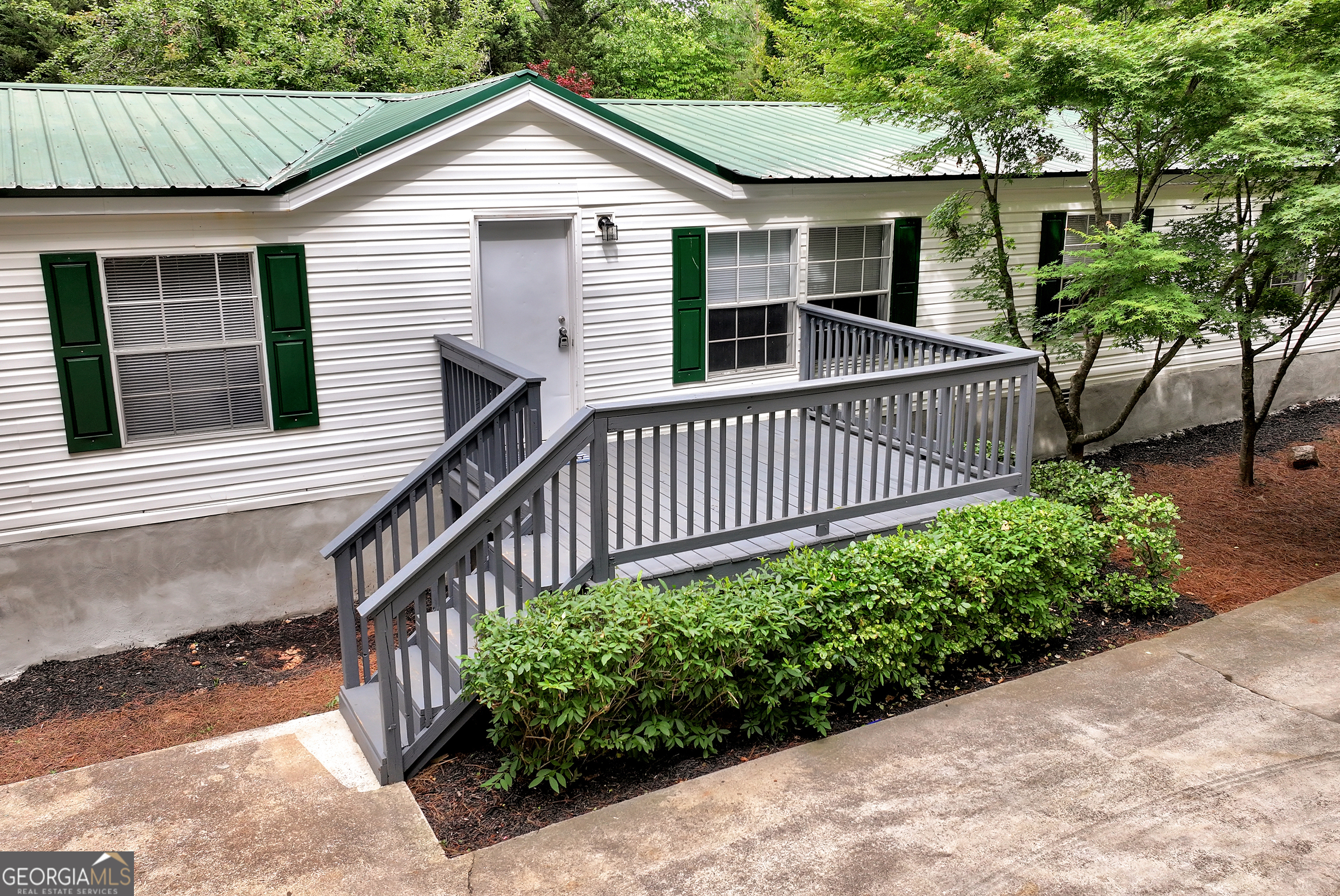 255 Double Branch Road Danielsville, GA 30633 - Photo 2 of 46 a front view of a house with a yard
