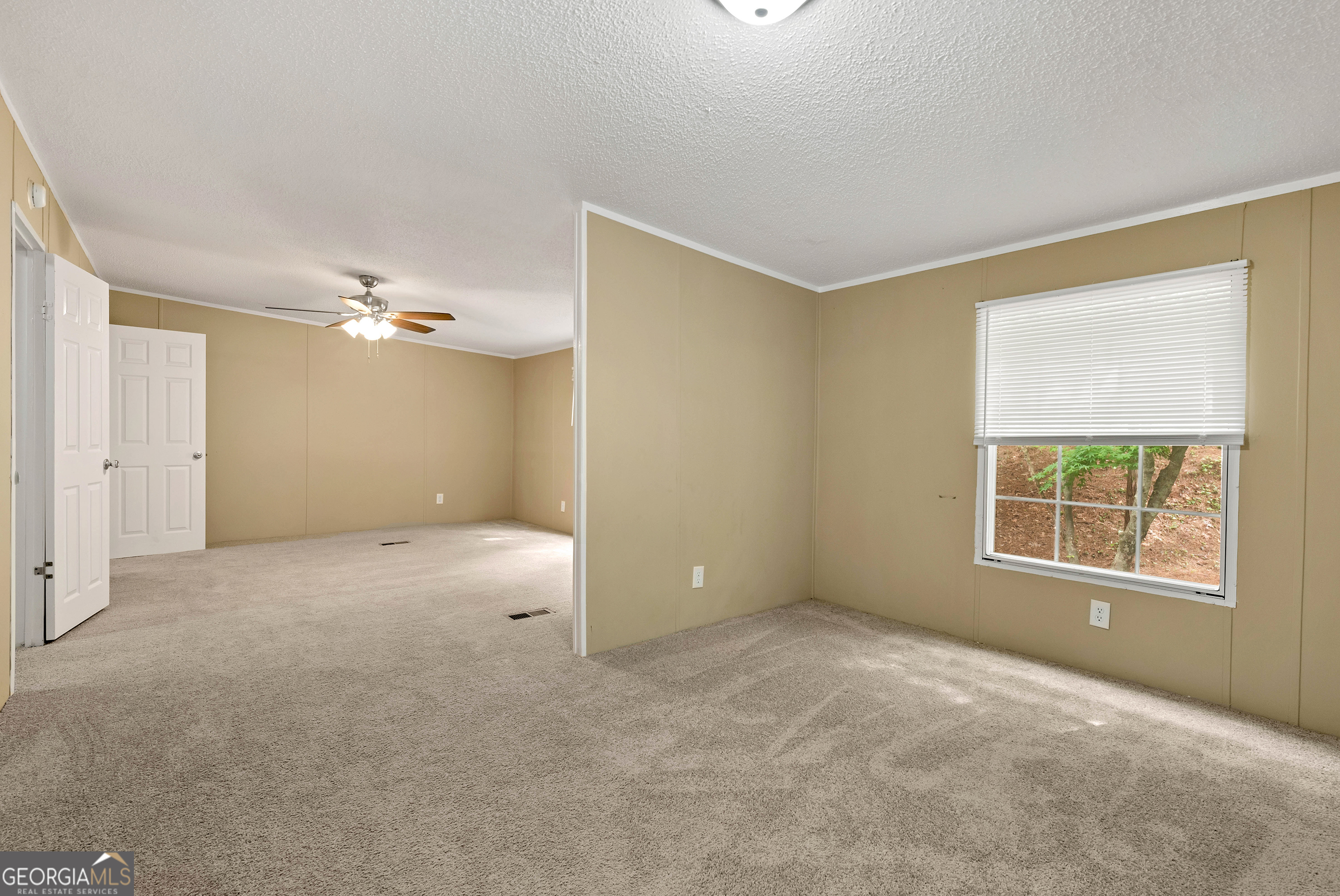 255 Double Branch Road Danielsville, GA 30633 - Photo 24 of 46 a view of an empty room with a window