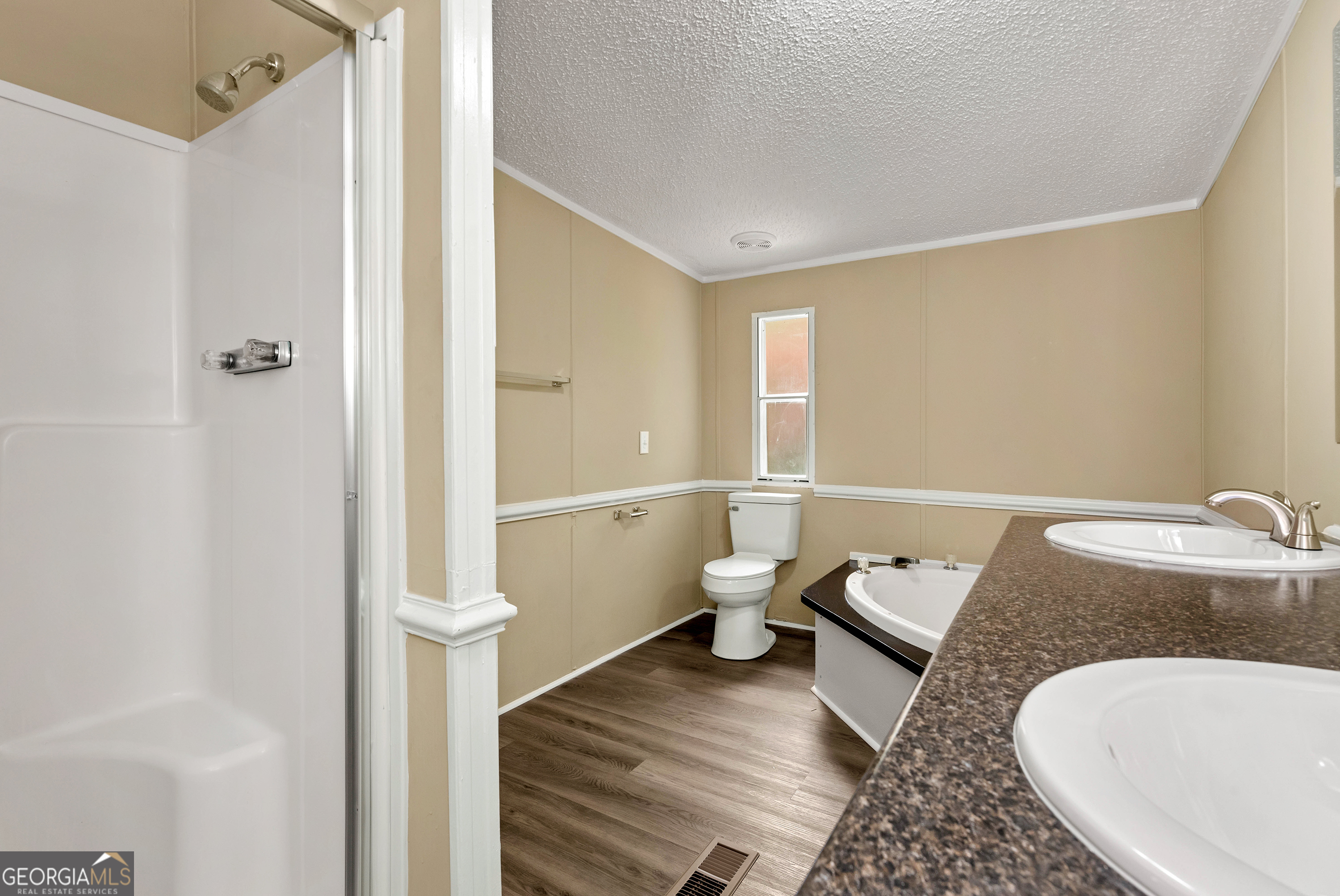 255 Double Branch Road Danielsville, GA 30633 - Photo 29 of 46 a bathroom with a granite countertop sink a toilet and shower