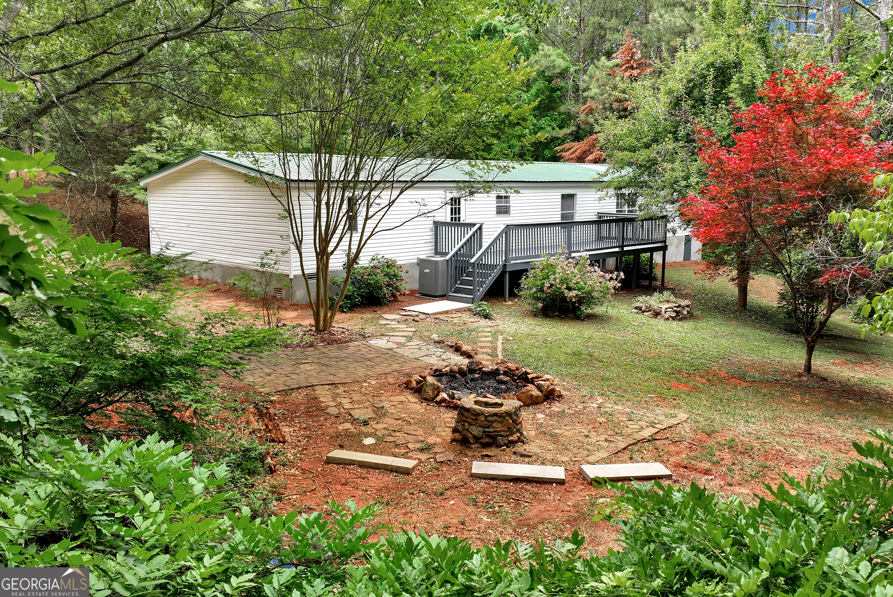 255 Double Branch Road Danielsville, GA 30633 - Photo 37 of 46 a view of backyard with a garden and trees