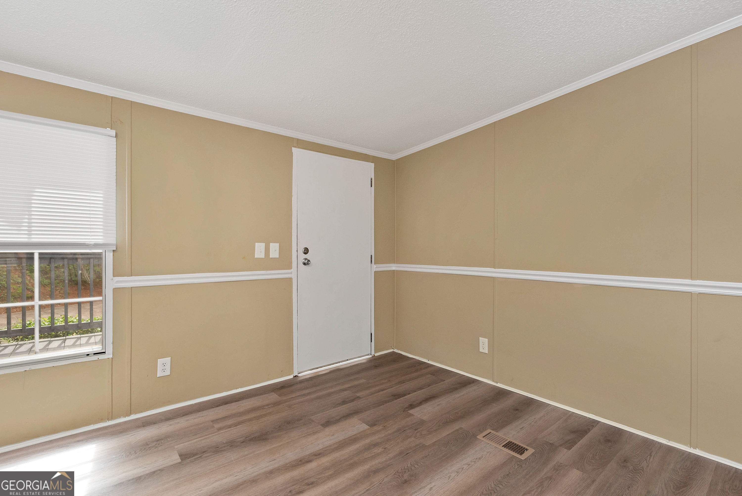 255 Double Branch Road Danielsville, GA 30633 - Photo 4 of 46 an empty room with windows