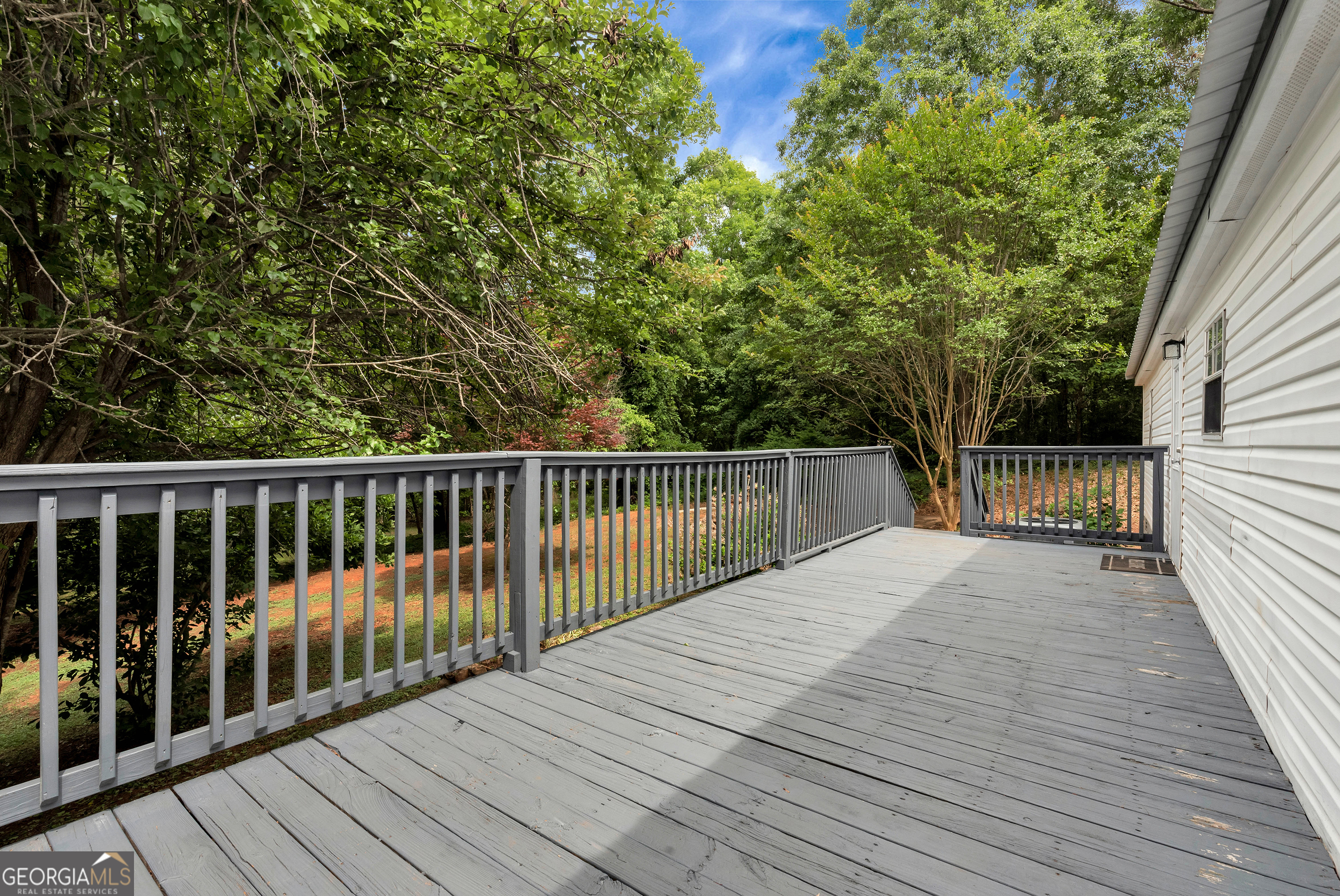 255 Double Branch Road Danielsville, GA 30633 - Photo 42 of 46 a balcony with wooden floor and fence