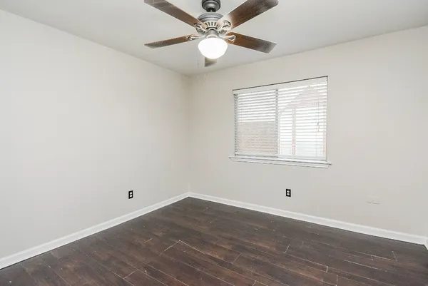 a spacious bathroom with a bathtub sink and mirror