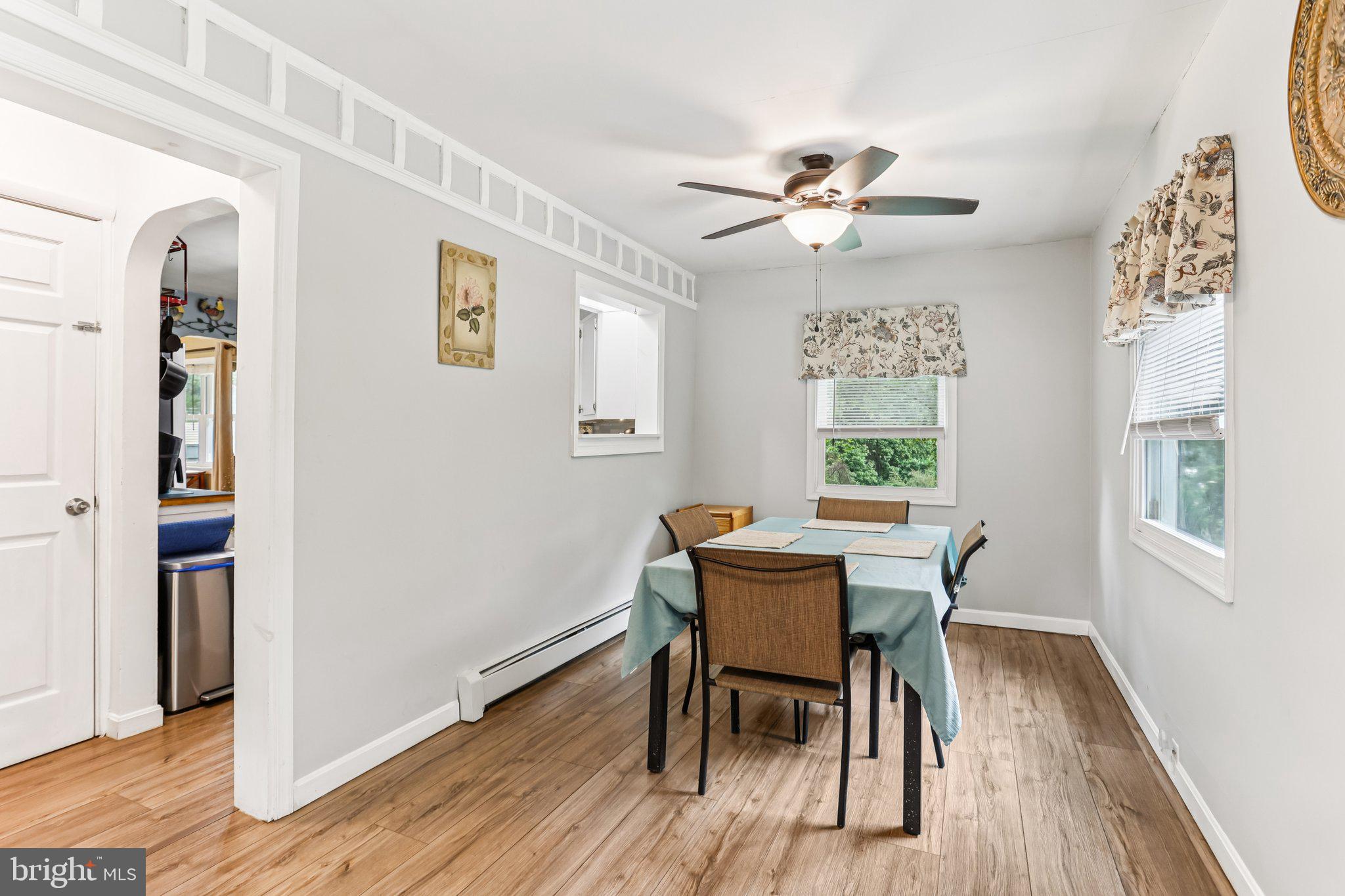 156 Valleyview Drive Exton, PA 19341 - Photo 12 of 26 a view of a dining room with furniture window and wooden floor