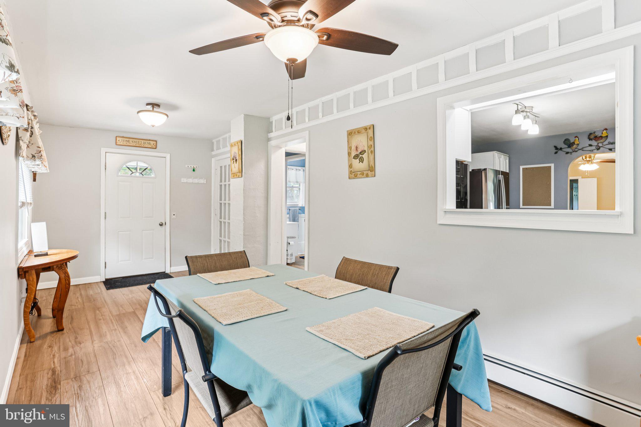 156 Valleyview Drive Exton, PA 19341 - Photo 13 of 26 a view of a dining room with furniture and wooden floor