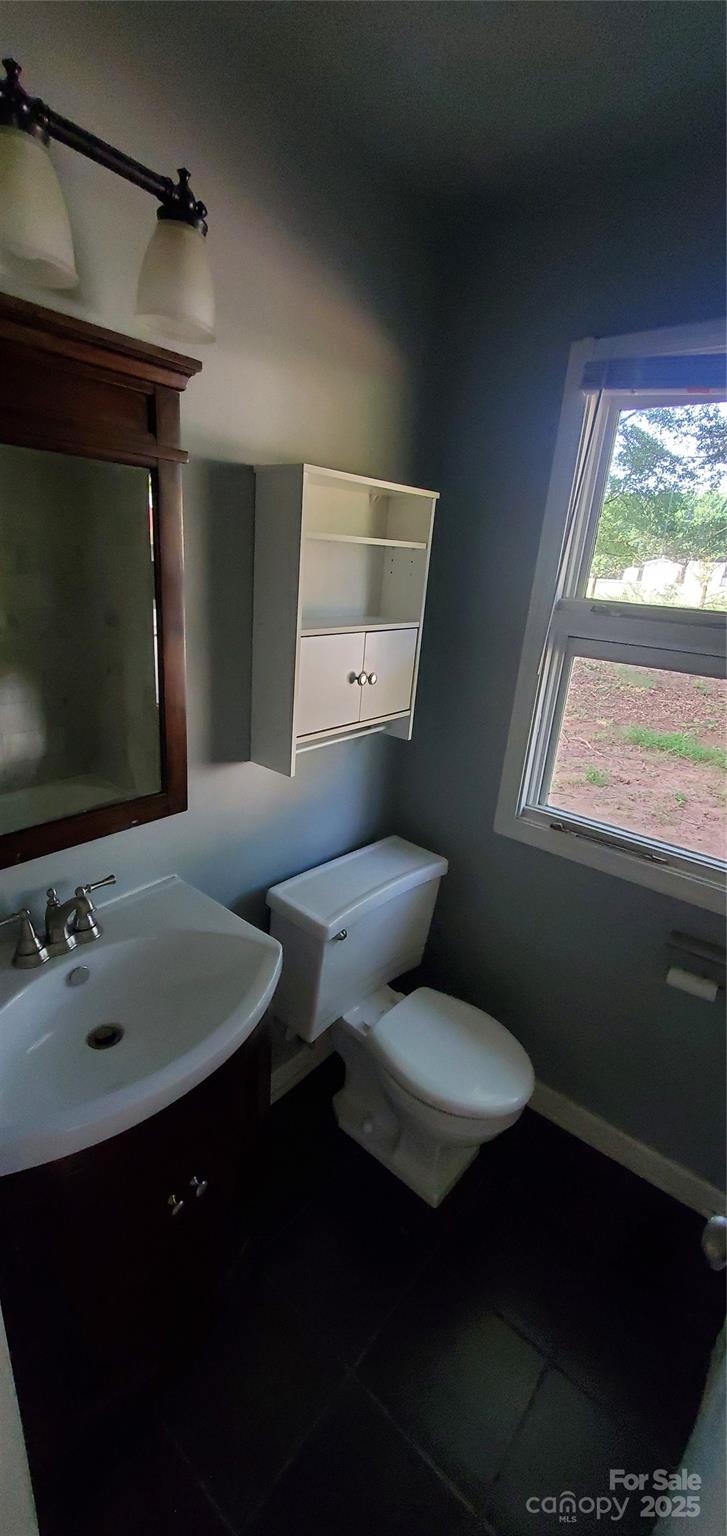 124 Roxie Lane Belmont, NC 28012 - Photo 5 of 6 a bathroom with a toilet sink and mirror