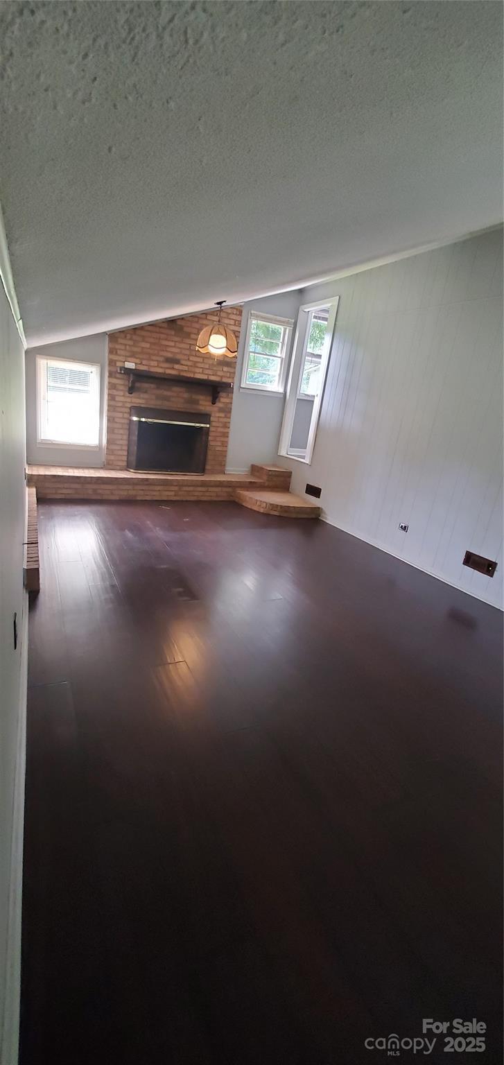124 Roxie Lane Belmont, NC 28012 - Photo 6 of 6 a view of empty room with stairs and wooden floor