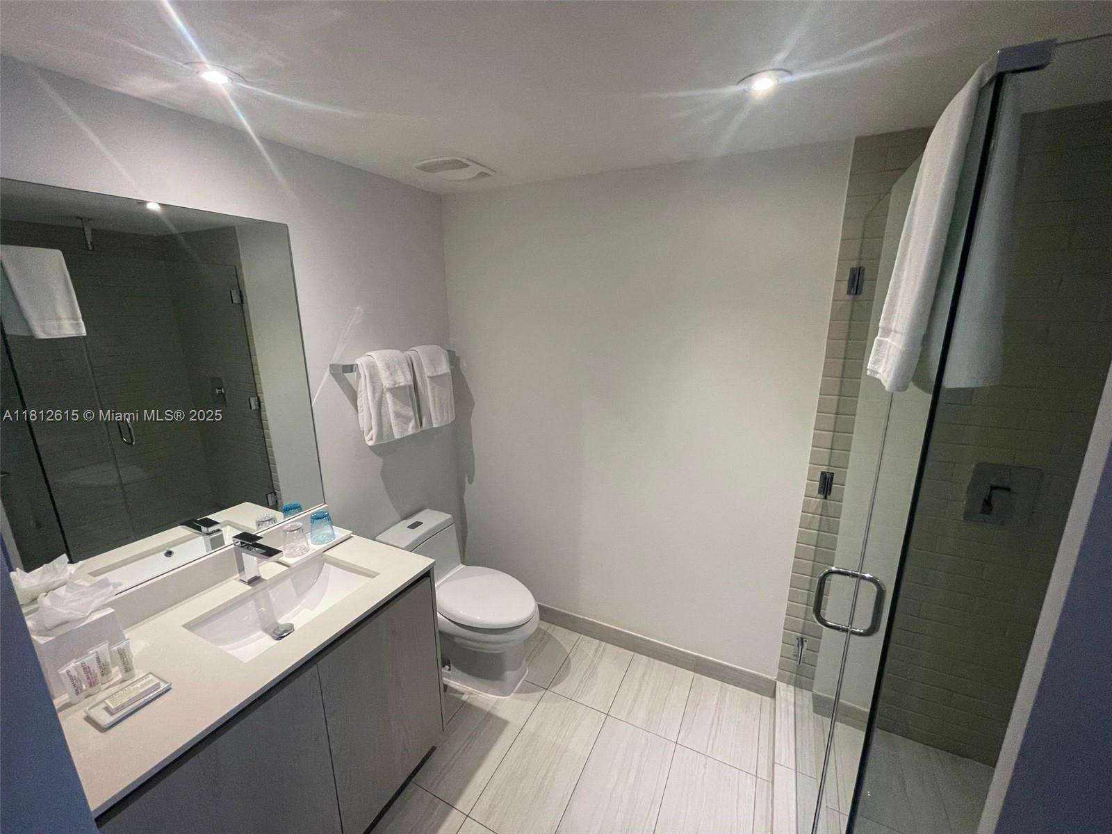 4010 South Ocean Drive, Unit R1705 Hollywood, FL 33019 - Photo 14 of 15 a bathroom with a sink toilet and shower