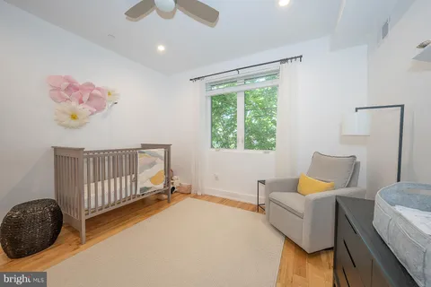 a bedroom with furniture and a window