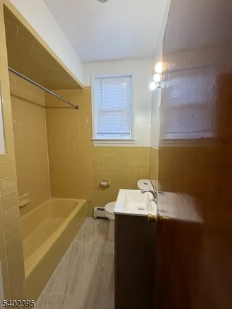 a bathroom with a sink and a bathtub