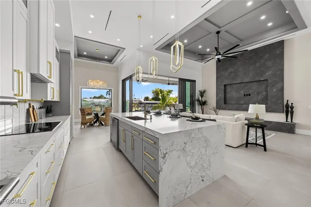 a view of a dining room with furniture and a chandelier